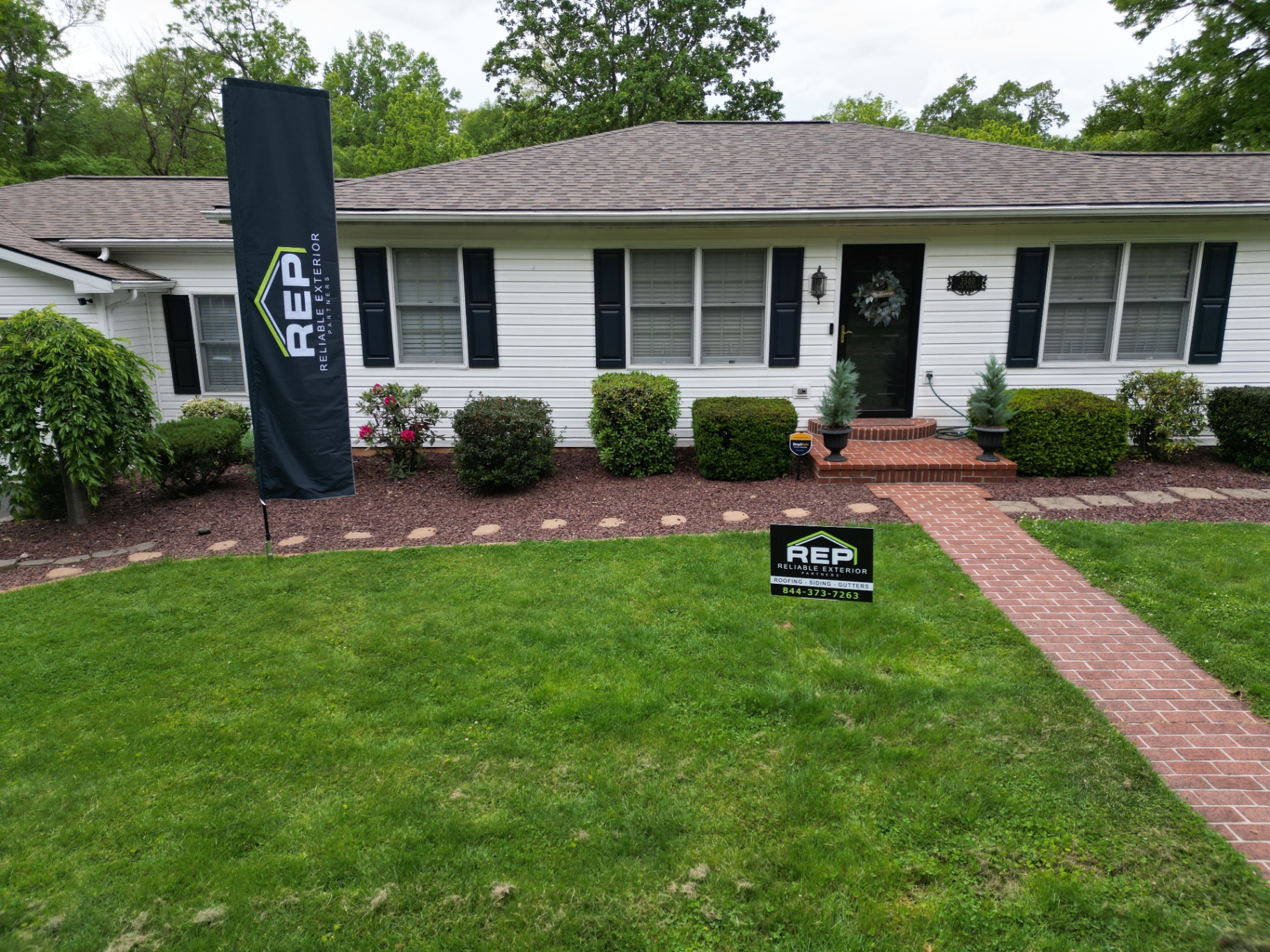 Reliable Exterior Partners project banner and yard sign at a Pennsylvania home